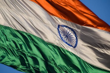 India flag flying high at Connaught Place with pride with plain white background, India flag fluttering, Indian Flag on Independence Day and Republic Day of India, tilt up shot, Har Ghar Tiranga
