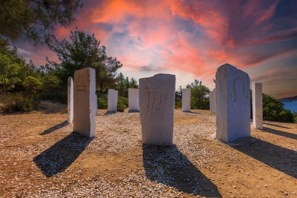 stock image Crown in Limenaria - 12 white stones carved with the signs of the zodiac, set in a circle according to the seasons on a hill above Limenaria on the island of Thassos. Stonehenge.