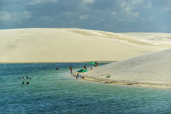 stock image Lencois Maranhenses, Barreirinhas, Maranhao State, Brazil, on July 9, 2024. Tourists in the lagoons and dunes.