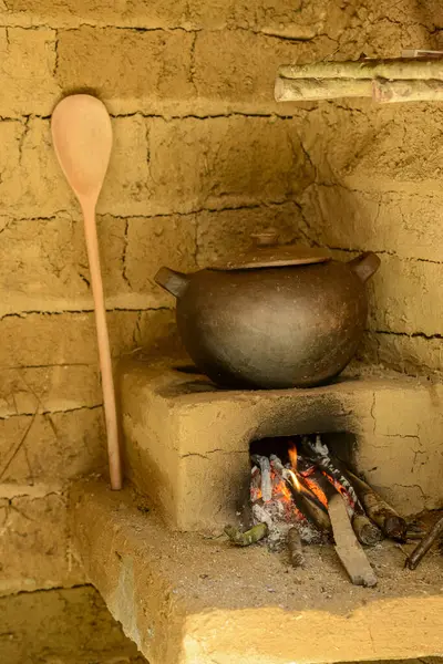 stock image Clay pot on rustic wood stove, backlands of northeastern Brazil.