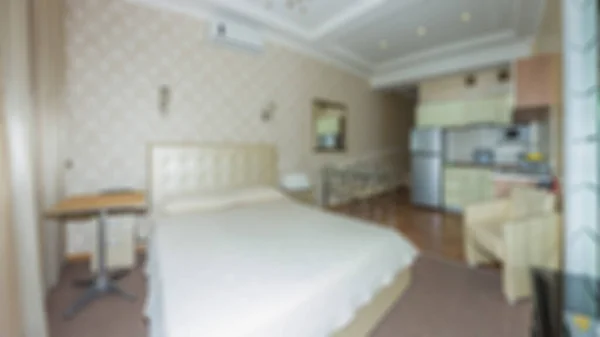Master bedroom with wood bed and water view for background Abstract blur and defocused apartment, condominium, hotel, commercial building.