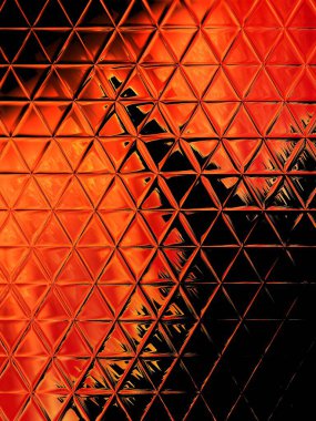 Mozaik varyasyon tasarımında benzer ama farklı üçgen şekilli fayanslara sahip canlı kırmızı turuncu ve siyah