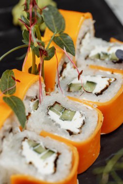 Rainbow Sushi Roll with salmon ee, tuna avocado royal prawn cream cheese Philadelphia caviar tobica chuka. Sushi menu. Japanese food. . High quality photo