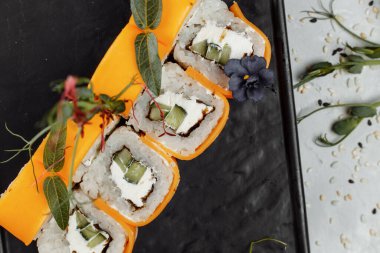 Rainbow Sushi Roll with salmon ee, tuna avocado royal prawn cream cheese Philadelphia caviar tobica chuka. Sushi menu. Japanese food. . High quality photo