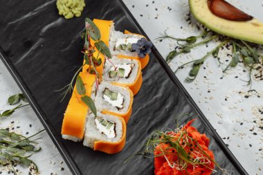 Rainbow Sushi Roll with salmon ee, tuna avocado royal prawn cream cheese Philadelphia caviar tobica chuka. Sushi menu. Japanese food. . High quality photo