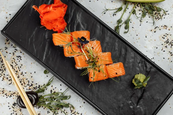 stock image Sushi Philadelphia on a stone decorative plate.