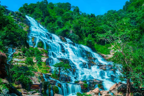 Amazing deep forest big waterfall at Mae Ya waterfall, Doi Inthanon national park Chiangmai, Thailand. Translate text \