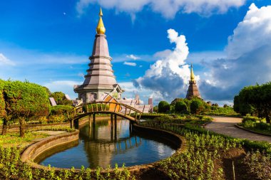 Beautiful landscape aerial view of Doi Inthanon in evening time with blue sky background buddhist stupa landmark tourism at Chiang Mai of north Thailand. clipart