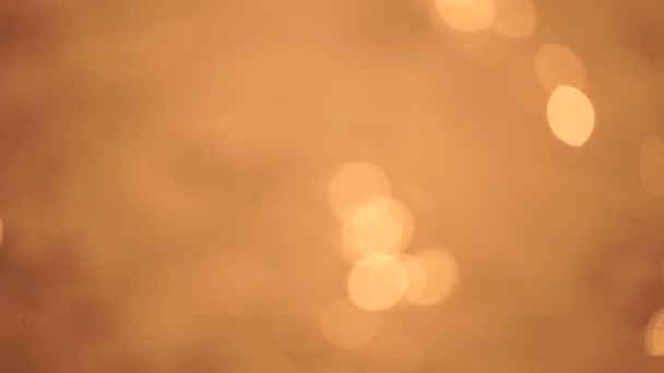 抽象的なブラーレッドビデオスクリーンセーバーボケ金色の海日没 太陽は波に反射して輝く — ストック動画