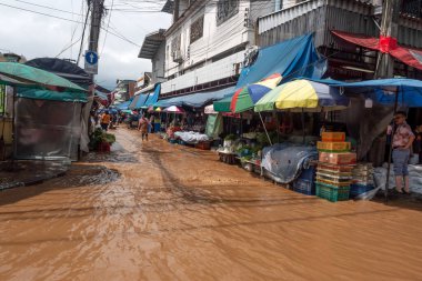 CHIANG MAI, THAILAND  4 October, 2024 : Chiang Mai market Flooding in Chiang Mai city near the Ping River, effect of heavy raining from the mountain.  clipart