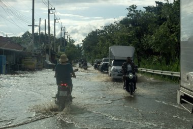 CHIANG MAI, THAILAND  4 October, 2024 : Chiang Mai market Flooding in Chiang Mai city near the Ping River, effect of heavy raining from the mountain.  clipart