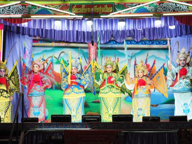 CHIANG MAI, THAILAND - FEBRUARY 17, 2025 : The actors of the Chinese Opera perform at Warorot market or Chinatown in Chiang Mai, Thailand. clipart