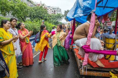 Unidentified people performing dance and various activity during iskcon kolkata ratha yatra 2024 clipart