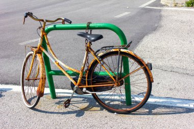 Old rusty vintage bicycle, parked and locked, Chioggia, Veneto, Italy, Europe clipart