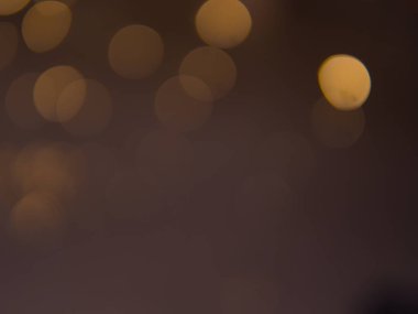 Altın ve koyu kahverengi Bokeh ışıkları şenlikli arka plan. Yüksek kalite fotoğraf