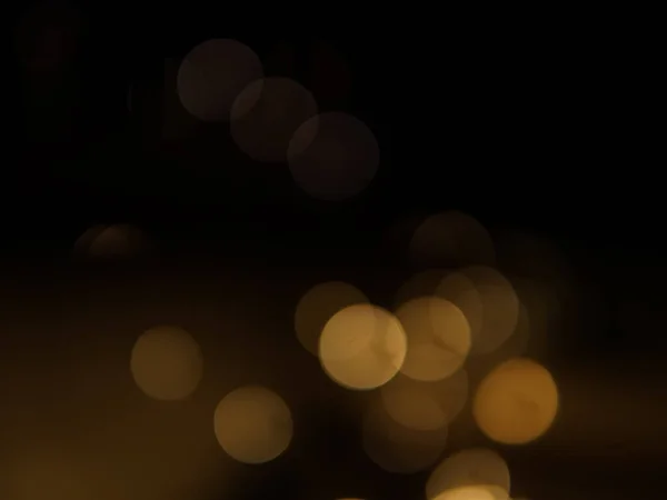 stock image Golden and dark brown round bokeh lights festive background . High quality photo