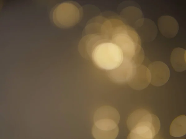 stock image Golden and dark brown round bokeh lights festive background . High quality photo