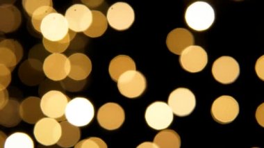 Yanıp sönen Noel altın arka planı, yuvarlak bokeh 