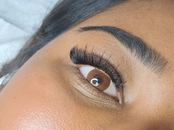 Close up of eyelash Extensions in beauty salon macro eye. High quality photo