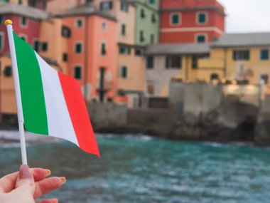 close up of tricolor national flag of Italy on seascape background