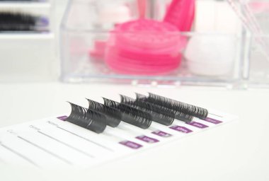 beauty salon equipment for eyelash extensions ,tools or lash technician white and pink colors.