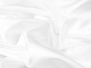 white silk fabrik background with copy space for inscription,satin backdrop and wallpaper.