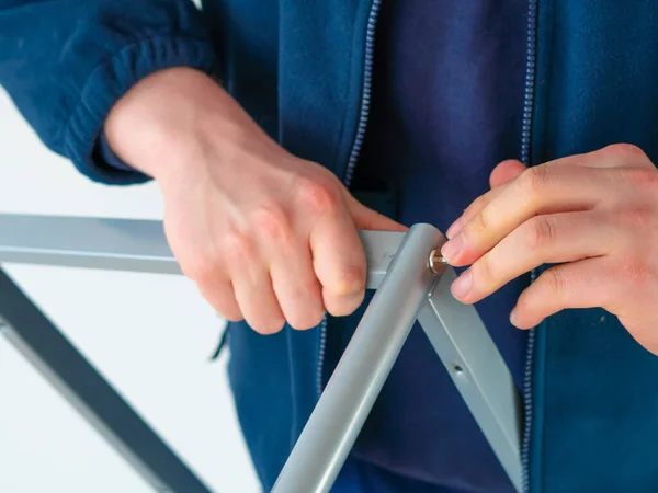 stock image handyman making furniture assembly using tools for repair.