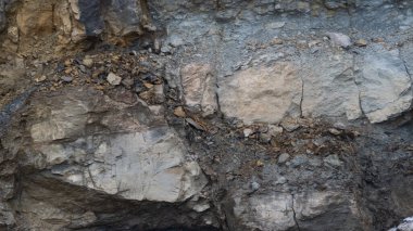 .Taş ölçekli arkaplan - çeşitli boyutlardaki taşların desenli yüzeyi.