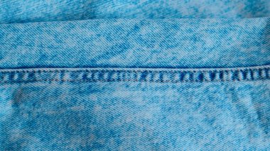 Detaylı desenli mavi kot kumaş. Moda ve tekstil tasarımı için mükemmel.