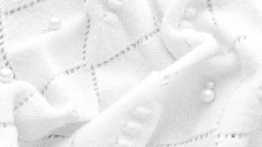 Minimalist beyaz kumaş arkaplan deseni örülmüş.