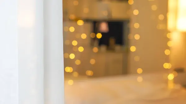 stock image cozy bedroom with bokeh garland lights, background.