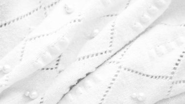 Minimalist beyaz kumaş arkaplan deseni örülmüş.