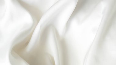 Yumuşak kıvrımlı ve hassas dokusu olan buruşuk beyaz ipek kumaş arkaplan
