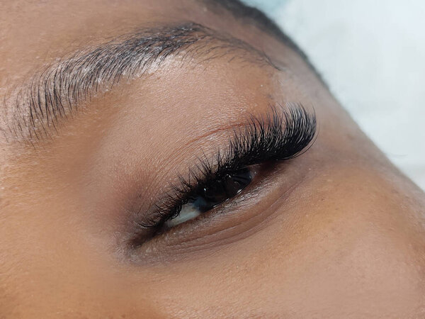 Close up of eye with eyelash extensions ,beauty salon treatment ,2d volume, 3d volume, classical lashes,Russian volume,megavolume, new set.
