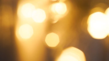 Soft golden bokeh background with a subtle glowing and elegant festive ambiance. clipart