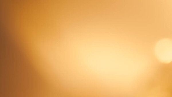 Soft golden bokeh background with a subtle glowing and elegant festive ambiance.