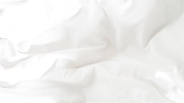 Kırışık beyaz çarşaf arka plan rahatlığı, sıcaklığı ve rahatlığı simgeliyor.