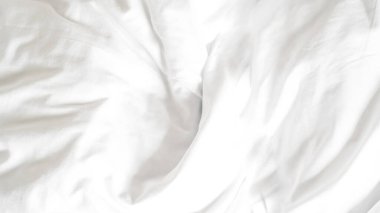 Kırışık beyaz çarşaf arka plan rahatlığı, sıcaklığı ve rahatlığı simgeliyor.