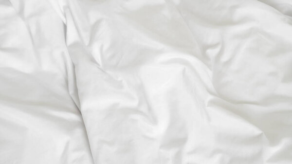 Soft white duvet on bed symbolizing hotel comfort and peaceful rest space.