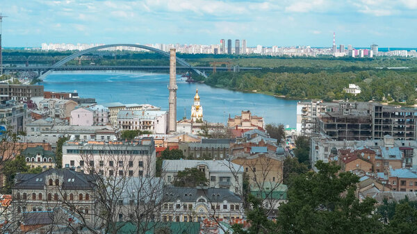 Scenic Kyiv skyline with green trees from Volodymyrska Hill in summer