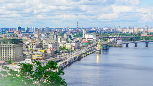 Scenic Kyiv skyline with green trees from Volodymyrska Hill in summer