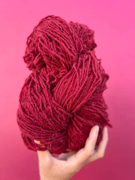 Skein of red yarn dyed with natural dyes of Cochineal insects in Tetotitlan del Valle, Oaxaca, Mexico.