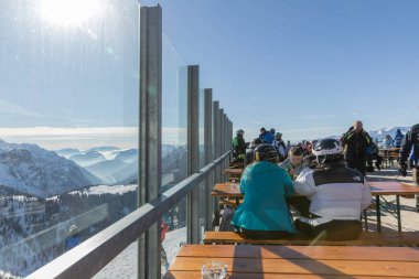 MADONNA DI CAMPIGLIO, ITALY - JANUARY 26, 2023: Bar Restaurant Rifugio Doss del Sabion is nestled in the middle of a fascinating 360-degree view of the Brenta Dolomites and Adamello-Presanella.