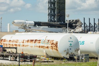 CAPE CANAVERAL, FLORIDA - 15 MARCH 2024. FALCON 9 rocket lying horizontally during repair. A rocket carrying a set of satellites into orbit around the earth, Elon Musk's company SpaceX. CAPE CANAVERAL clipart