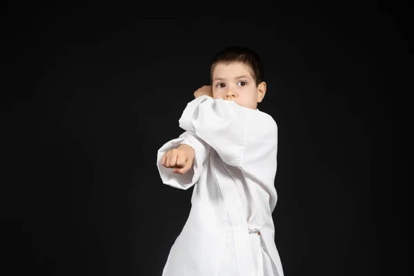 Little Boy Practices Martial Arts Karate Classes Kimono Black Background — Stock Photo, Image