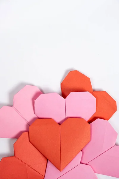 stock image Origami for Valentines Day - hearts made of paper on a white background do it yourself.