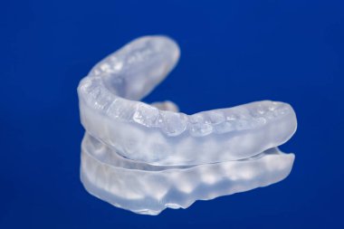 Dental mouthguard, splint for the treatment of dysfunction of the temporomandibular joints, bruxism, malocclusion, to relax the muscles of the jaw clipart