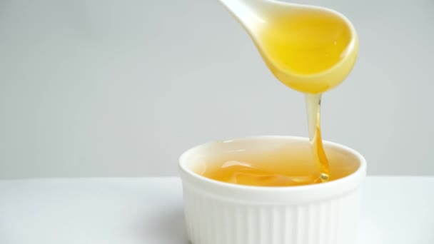 Liquid Bee Honey Spoon Showing Linden Fresh Honey White Background — Stock video