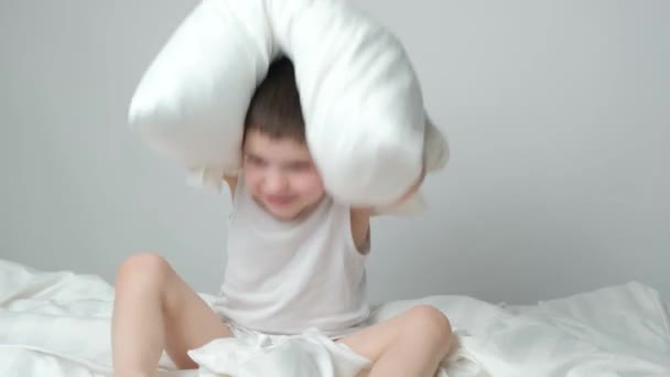 Cool Year Old Boy Playing Bed Pillow Having Fun Laughing — Stock Video