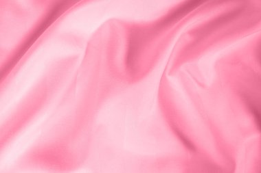 Abstract pink fabric background, satin stripe texture, wavy folds of elegant expensive fabric.